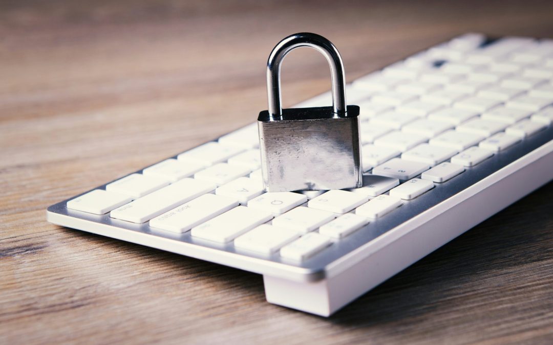a computer keyboard with a padlock on top of it